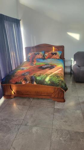 a bedroom with a bed with a dog blanket at Casa Boa Casita Tambor in La Abuela