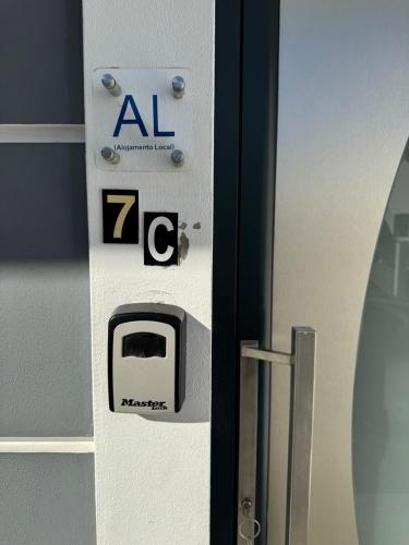 a door with an activate sign on a refrigerator at Charming Holiday Home with Free Private Parking in Machico