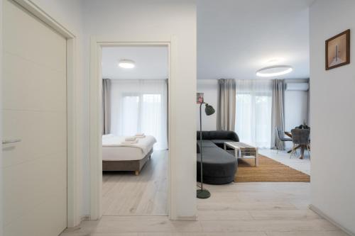 Ένα ή περισσότερα κρεβάτια σε δωμάτιο στο Pipera Garden Loft 2BR