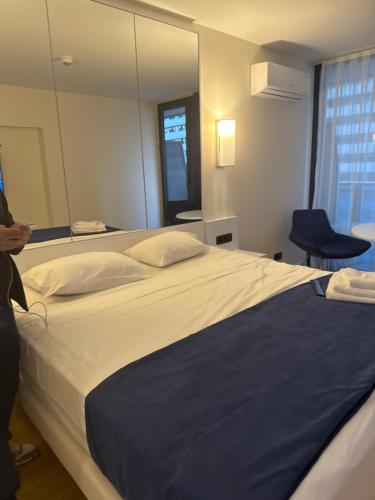 Un pat sau paturi într-o cameră la New Orbi City Cenetr