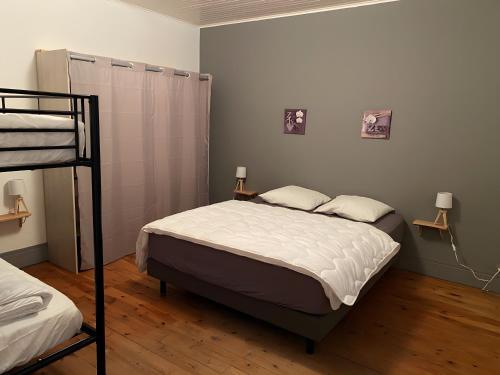 Voodi või voodid majutusasutuse Gîte Crèmouille toas