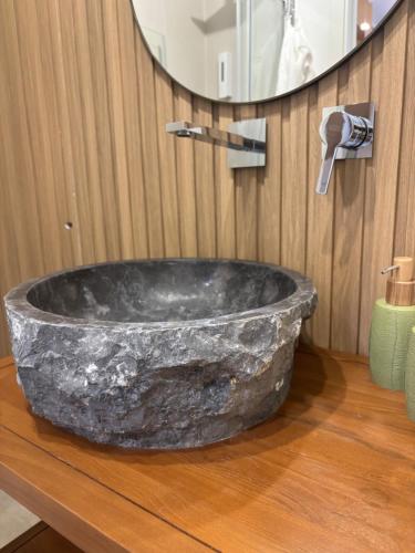 a bathroom with a large stone tub on a counter at Panta Rei 97 in Barletta