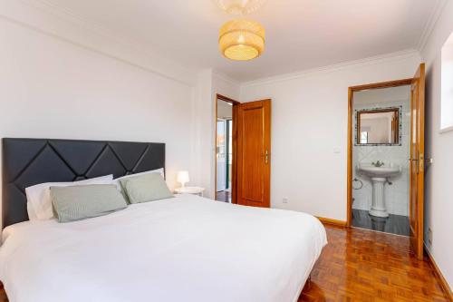 Postel nebo postele na pokoji v ubytování Cravo's House