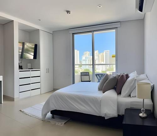 Кровать или кровати в номере Moderna suite cerca del mar