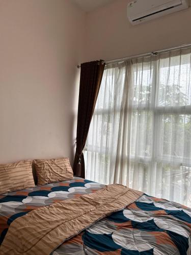 Ένα ή περισσότερα κρεβάτια σε δωμάτιο στο Magnolia Homestay