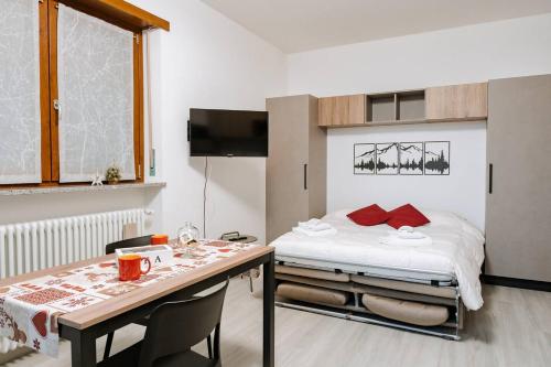 Postel nebo postele na pokoji v ubytování La Faustina Aosta