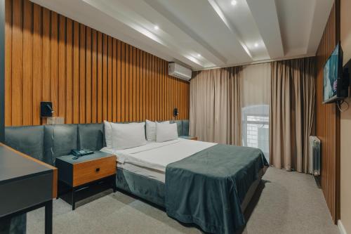 Ένα ή περισσότερα κρεβάτια σε δωμάτιο στο Onze Boutique Hotel Baku