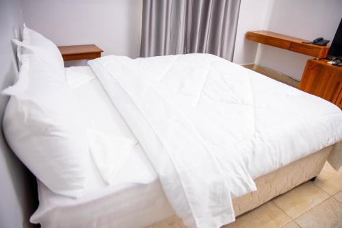 Postel nebo postele na pokoji v ubytování Salt Garden Inn