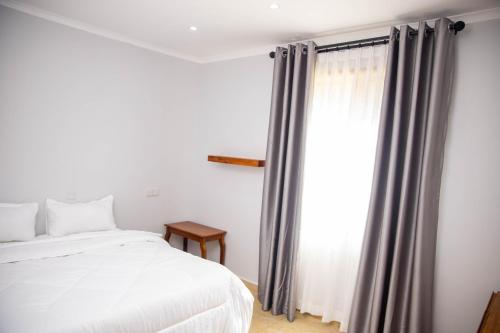 Postel nebo postele na pokoji v ubytování Salt Garden Inn