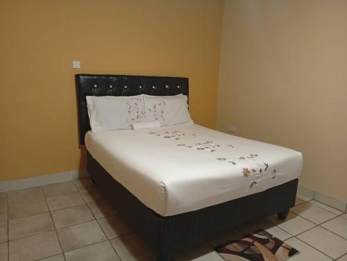 Ένα ή περισσότερα κρεβάτια σε δωμάτιο στο WilN Apartments