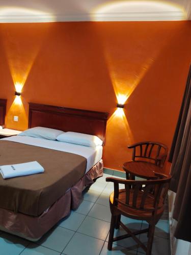 Postel nebo postele na pokoji v ubytování Megah Inn Home Inanam