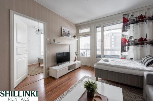 Foto Homelike 1BR with Free Parking, Sauna & Balcony 1