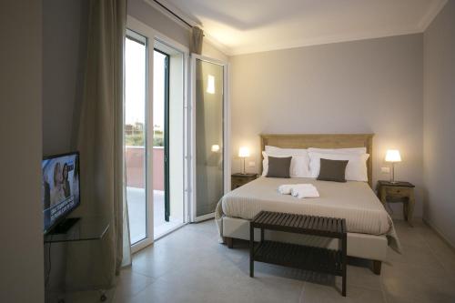 Postel nebo postele na pokoji v ubytování Corte Olea Resort