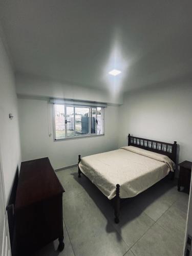 En eller flere senge i et værelse på Los Agapanthus