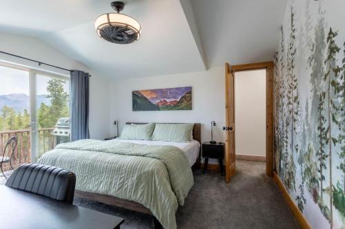 a bedroom with a bed and a balcony at 3 BR Fraser Apartment in Fraser