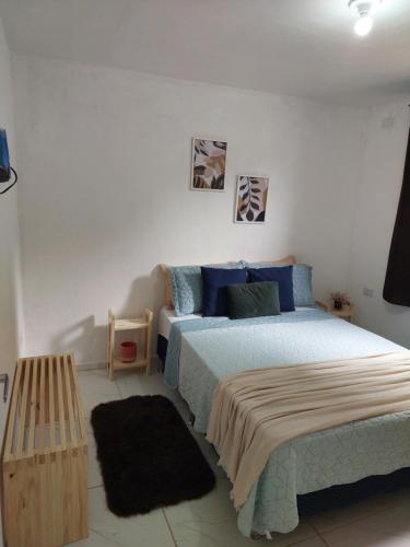 En eller flere senge i et værelse på Vila Negreiros Serra Negra Casa 1