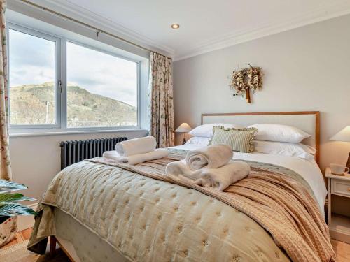 Кровать или кровати в номере 6 Bed in Keswick 94361