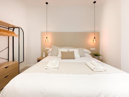 Ένα ή περισσότερα κρεβάτια σε δωμάτιο στο TAYP Navalmoral Apartamentos