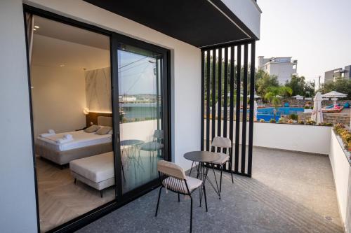 Ένα ή περισσότερα κρεβάτια σε δωμάτιο στο Memai Suites