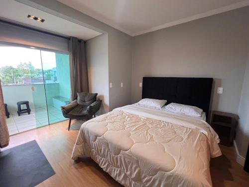 Ένα ή περισσότερα κρεβάτια σε δωμάτιο στο IR05 · Apartamento Incrível