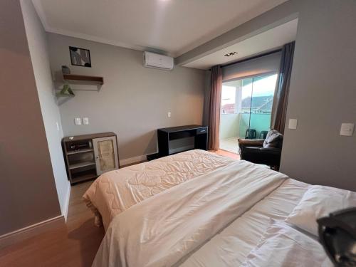 Ένα ή περισσότερα κρεβάτια σε δωμάτιο στο IR05 · Apartamento Incrível