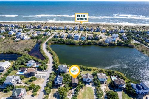 an aerial view of a resort with a sign at 8194 - Southern Grace in Waves