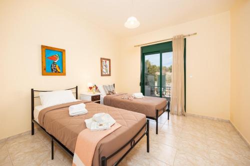 Ένα ή περισσότερα κρεβάτια σε δωμάτιο στο Villa Phoebe