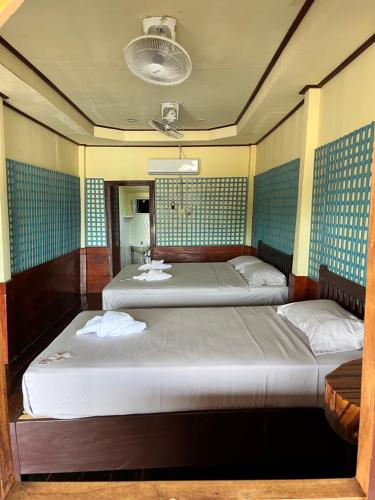 Ένα ή περισσότερα κρεβάτια σε δωμάτιο στο Friendship Guesthouse Dondet