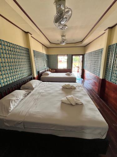 Ένα ή περισσότερα κρεβάτια σε δωμάτιο στο Friendship Guesthouse Dondet