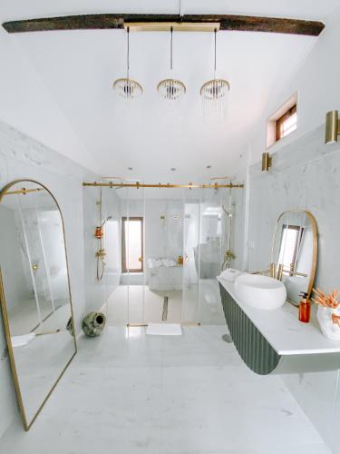 a bathroom with a shower and a sink and a mirror at Casa SaloYa - Sintra Historical Center in Sintra