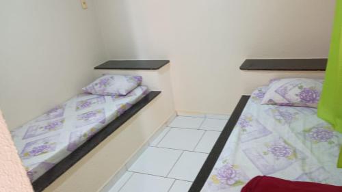 Ένα ή περισσότερα κρεβάτια σε δωμάτιο στο Pousada Moura