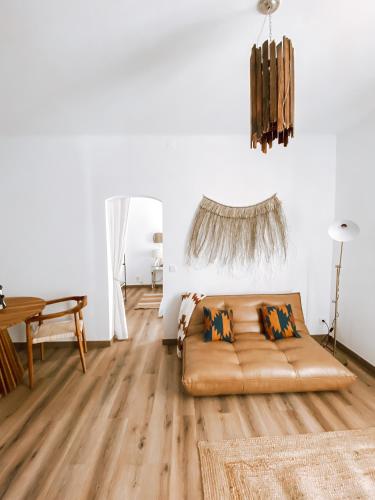 a living room with a couch and a table at Casa SaloYa - Sintra Historical Center in Sintra