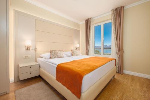 Ένα ή περισσότερα κρεβάτια σε δωμάτιο στο Villa Tunera - Luxury Apartments I