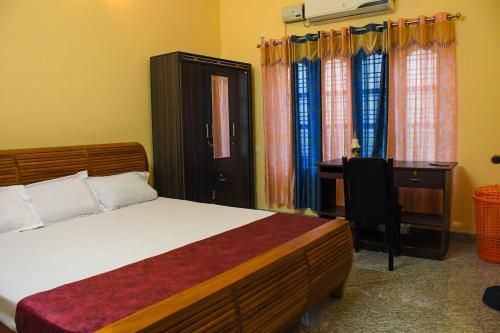 Ένα ή περισσότερα κρεβάτια σε δωμάτιο στο Gods Own Homestay