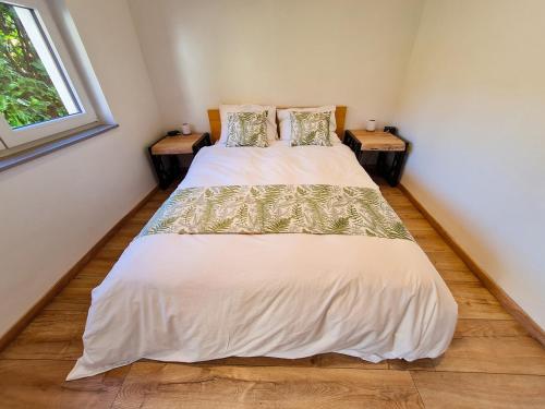 Ένα ή περισσότερα κρεβάτια σε δωμάτιο στο Ô Jardin