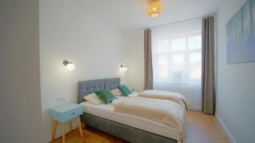 Ένα ή περισσότερα κρεβάτια σε δωμάτιο στο Apartamenty EverySky Kowary, 1-go Maja 62