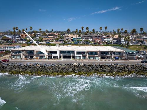 an aerial view of a building next to the water at 700-104 Water Front Condo w AC in Oceanside
