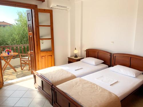 Postel nebo postele na pokoji v ubytování Gaia Apartments