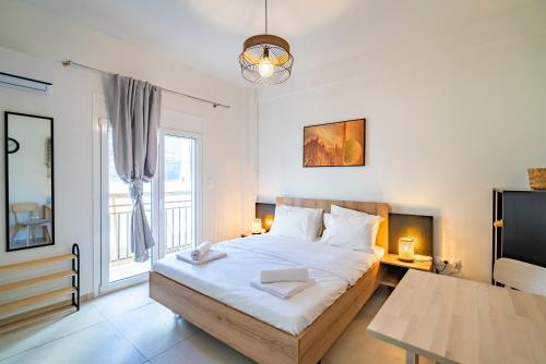Ένα ή περισσότερα κρεβάτια σε δωμάτιο στο UrbanKeys Athens