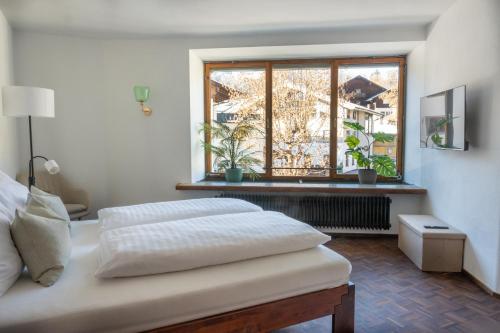 Postel nebo postele na pokoji v ubytování Hornweg Suites