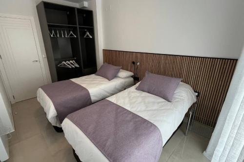 Ένα ή περισσότερα κρεβάτια σε δωμάτιο στο Principado de Aracena I