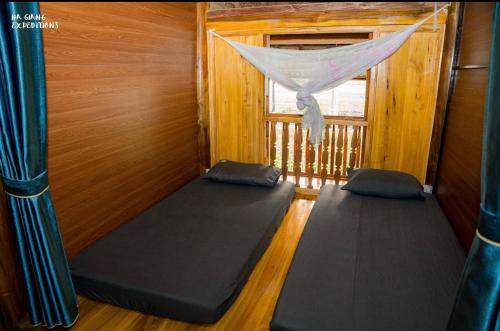 a room with two meditation mats in front of a window at Expeditions home in Ha Giang
