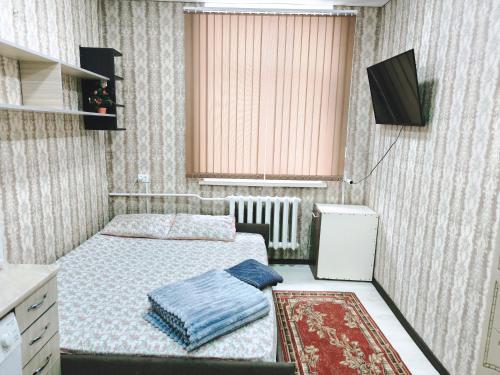 Postel nebo postele na pokoji v ubytování Parcul Ștefan cel mare și sfânt