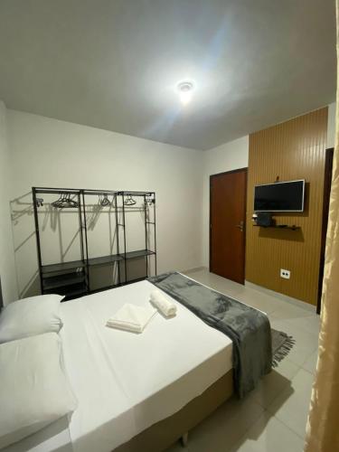 Ένα ή περισσότερα κρεβάτια σε δωμάτιο στο Apê moderno e aconchegante!