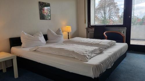 Postel nebo postele na pokoji v ubytování Hotel 3H Mannheim