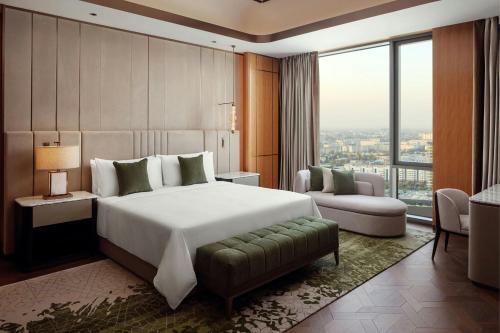 Ένα ή περισσότερα κρεβάτια σε δωμάτιο στο JW Marriott Hotel Tashkent
