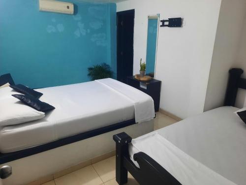 Ένα ή περισσότερα κρεβάτια σε δωμάτιο στο Hostal Santa Maria City