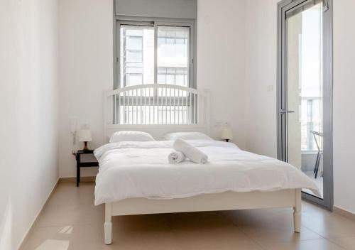 Ένα ή περισσότερα κρεβάτια σε δωμάτιο στο O&O Group - Sea View Tower - 32nd Floor Parking