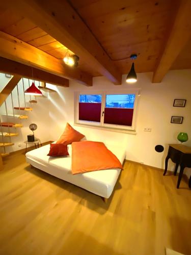 a bedroom with a bed and a table in a room at "Nestl" in Bad Häring