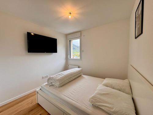 A bed or beds in a room at Appartement 4 pers à 200m du Skyvall